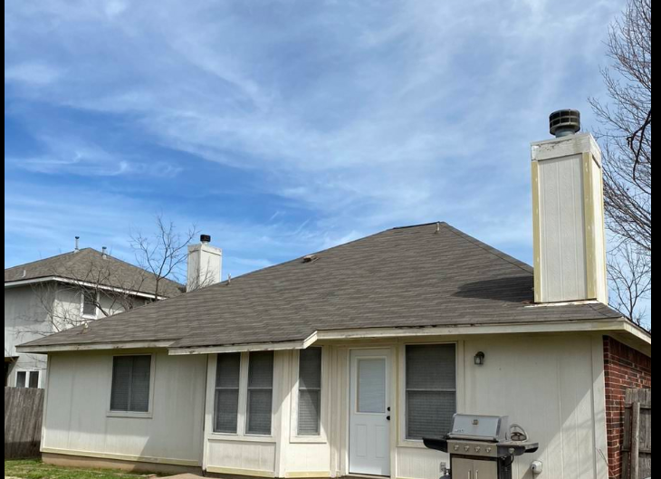 Luxury Austin Texas home exterior showing well-maintained roof and curb appeal representing strong property value and homeowner investment protection